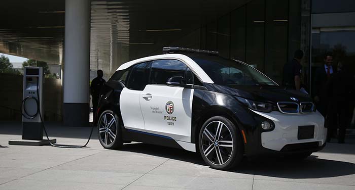 Los Angeles City Mayor Eric Garcetti and Los Angeles Police Department Chief Charlie Beck announce a year long test of a BMW i3 electric vehicle at a City of Los Angeles press conference in Los Angeles, Sept. 11, 2015. Photo by Danny Moloshok/Newscast